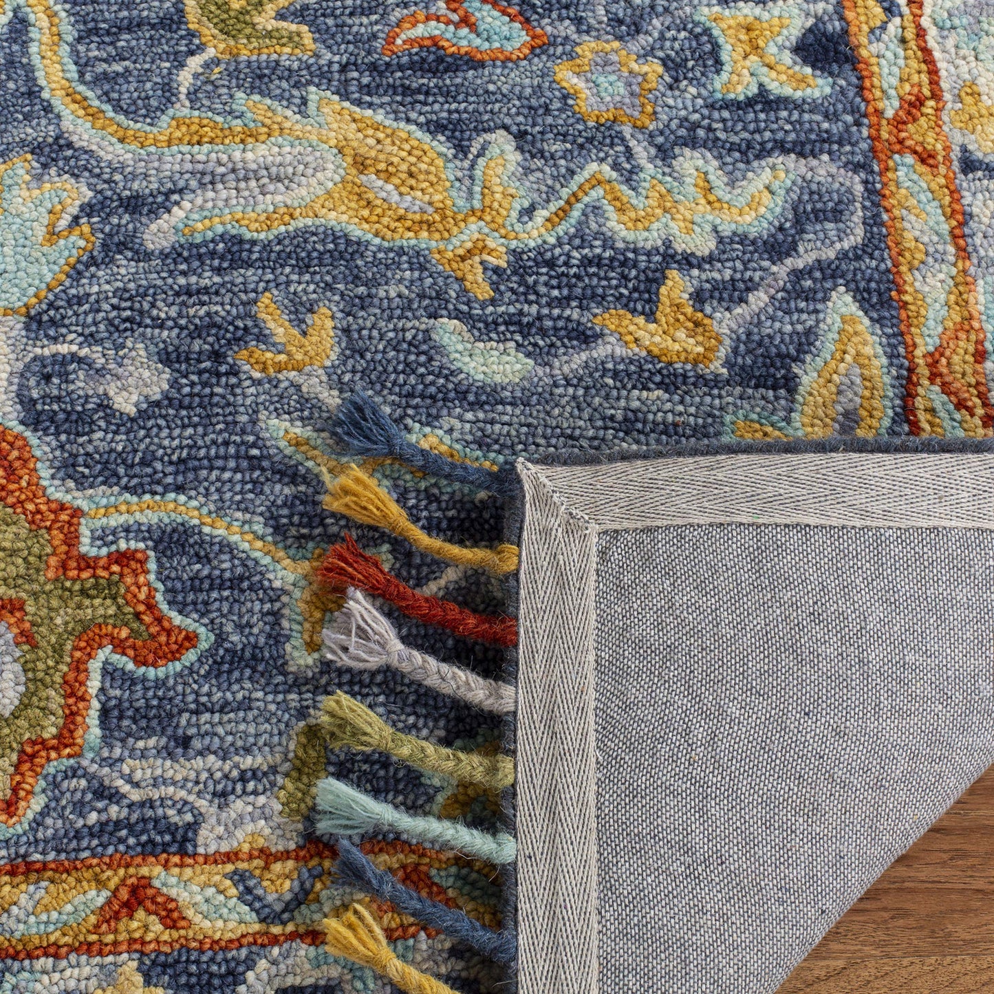 SAFAVIEH Aspen Collection Runner Rug - 2'3" x 7', Blue & Rust, Handmade Boho Braided Tassel Wool, Ideal for High Traffic Areas in Living Room, Bedroom (APN116M)