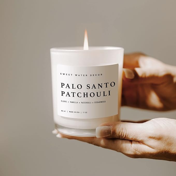 Sweet Water Decor Palo Santo Patchouli Candle - Soy Clove, Vanilla, Cedarwood, Patchouli Scented Spa Candle for Home - 11oz White Jar with Wood Lid, 50+ Hour Burn Time, Made in The USA
