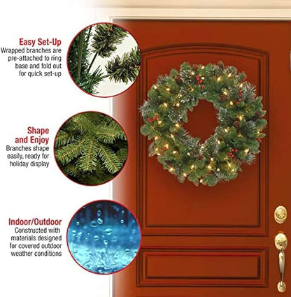 National Tree Company Pre-Lit Artificial Christmas Wreath, Green, Crestwood Spruce, White Lights, Decorated with Pine Cones, Berry Clusters, Christmas Collection, 24 Inches