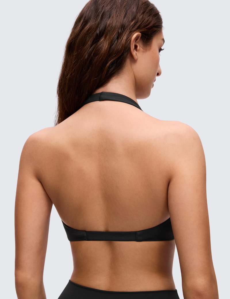 CRZ YOGA Butterluxe Double Lined Twist Halter Sports Bras for Women - Deep V Neck Crop Top Casual Open Back Non Padded Black Medium