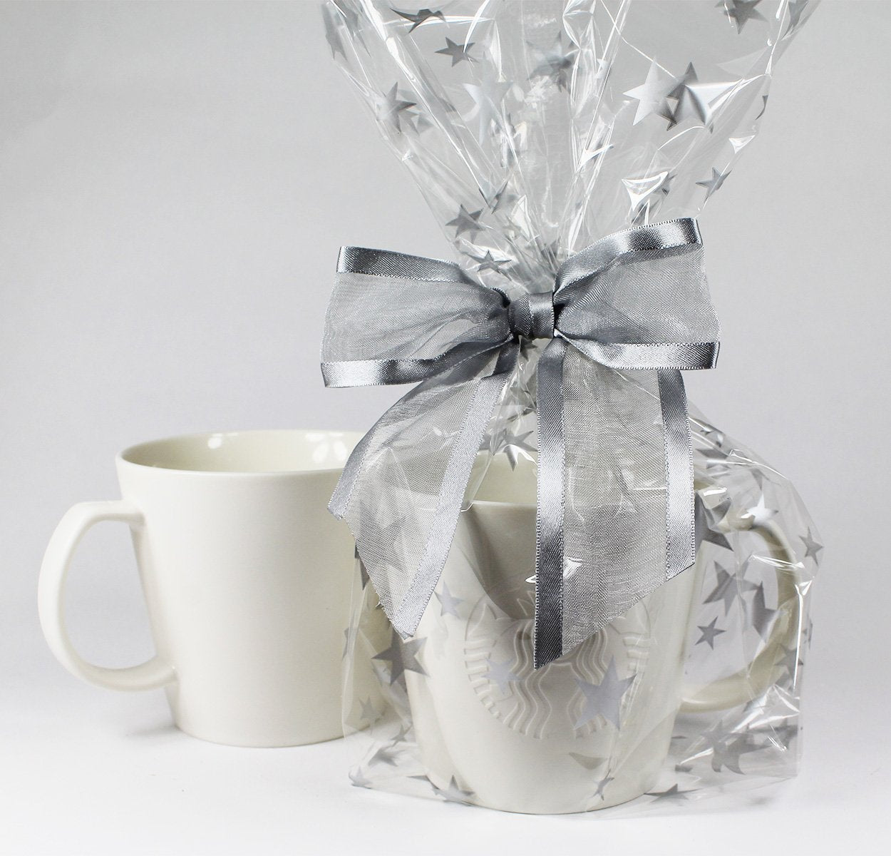 Saybrook Products Silver Stars Christmas Holiday Hanukkah Cellophane Treat Party Favor Bags with Twist-Tie Organza Bow. Set of 10 Ready-to-Use, Gussetted 11x5x3 Goodie Bags with Silver Metallic Bows.