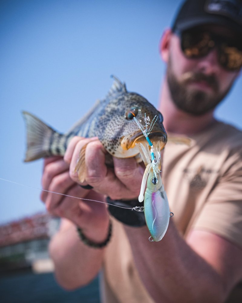Nomad Design Squidtrex Patented Vibrating Fishing Lure- Scent Added TPE Soft Plastic Lure for Saltwater w/Strong BKK Assist Hooks, Fishing Bait that Catches Many Species, 75mm 1/2oz- Green Gold Gizzy