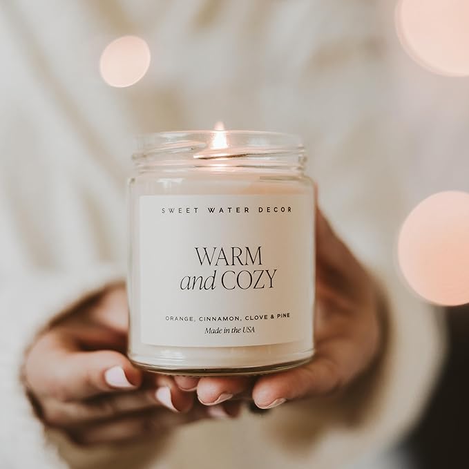 Sweet Water Decor Warm and Cozy Candle - Orange Peel, Cinnamon, Ginger and Clove Soy Winter Scented Candles for Home - 9oz Clear Jar + Gold Lid, 40+ Hour Burn Time, Made in The USA