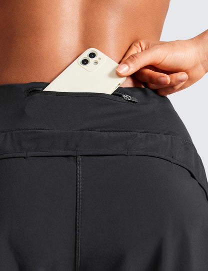 CRZ YOGA Mid Waisted Running Shorts for Women 4" Soft for Gym Athletic Workout with Zipper Pocket Liner Quick Dry Black Medium
