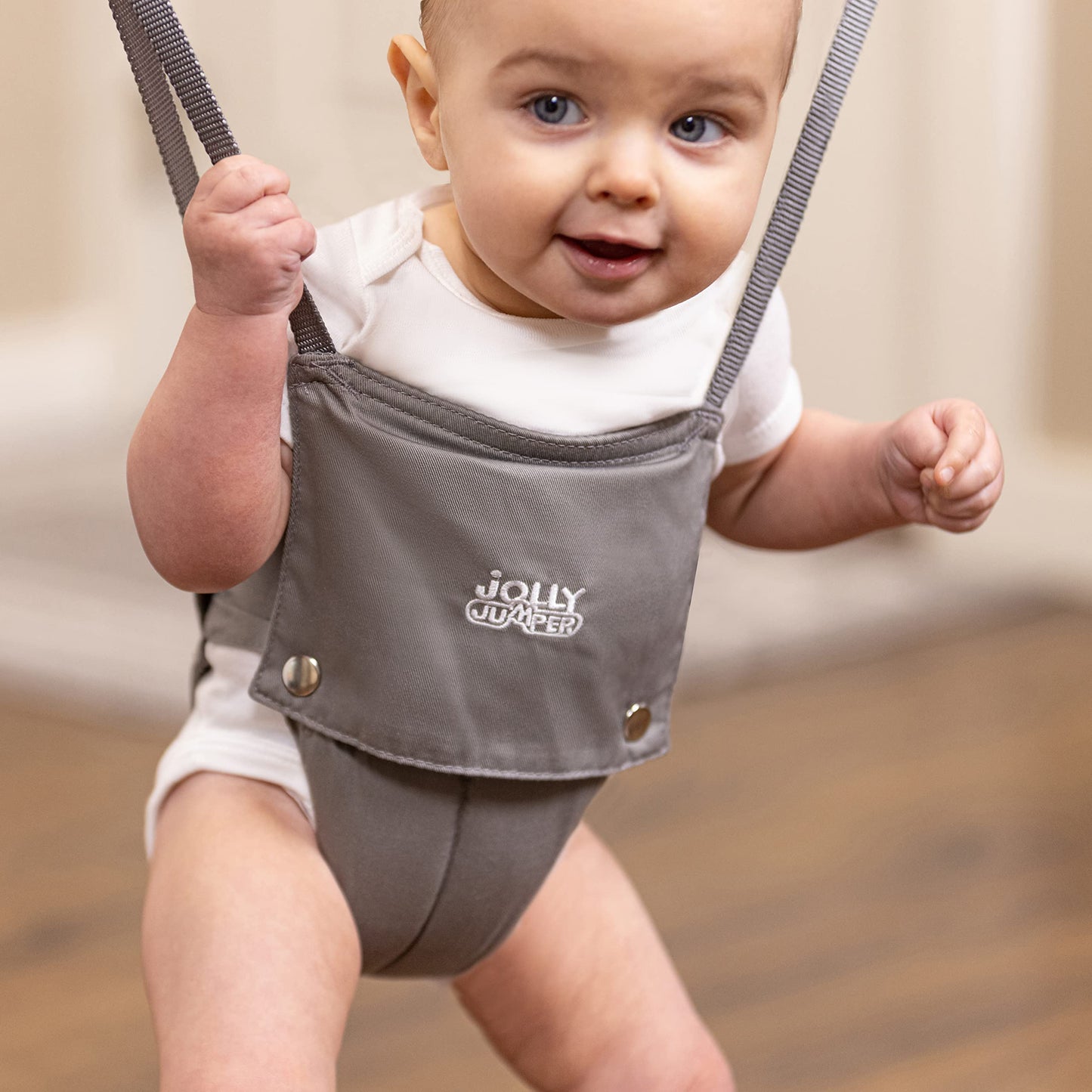 Jolly Jumper *Elite* Safari Print Saddle - The Original Jolly Jumper with Stand. Trusted by Parents to Provide Fun for Babies and to Create Cherished Memories for Families for Over 75 Years.