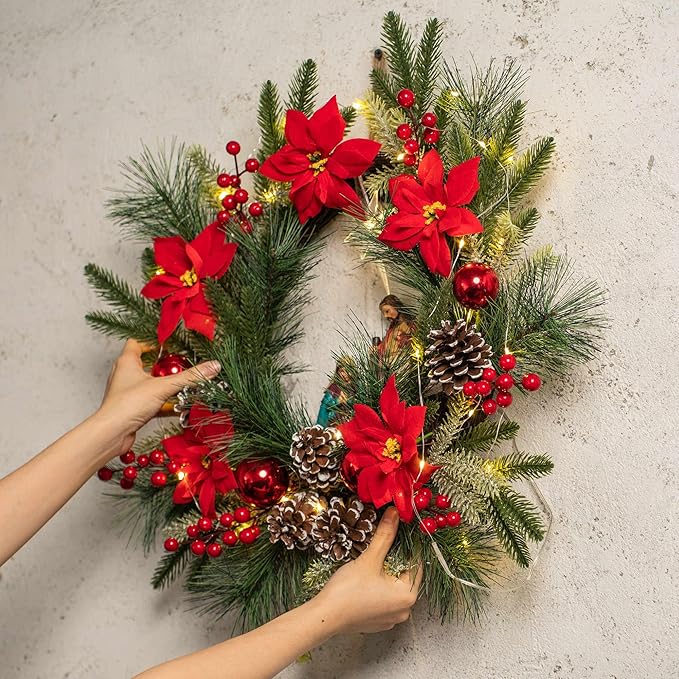 YULETIME 20" Pre-Lit Nativity Wreath, Battery Operated with 10 Fairy Lights, Holy Family Nativity Statue, Star of Bethlehem, Pine Cones, Red Poinsettia & Berries, Pine Needles (Nativity Poinsettia)