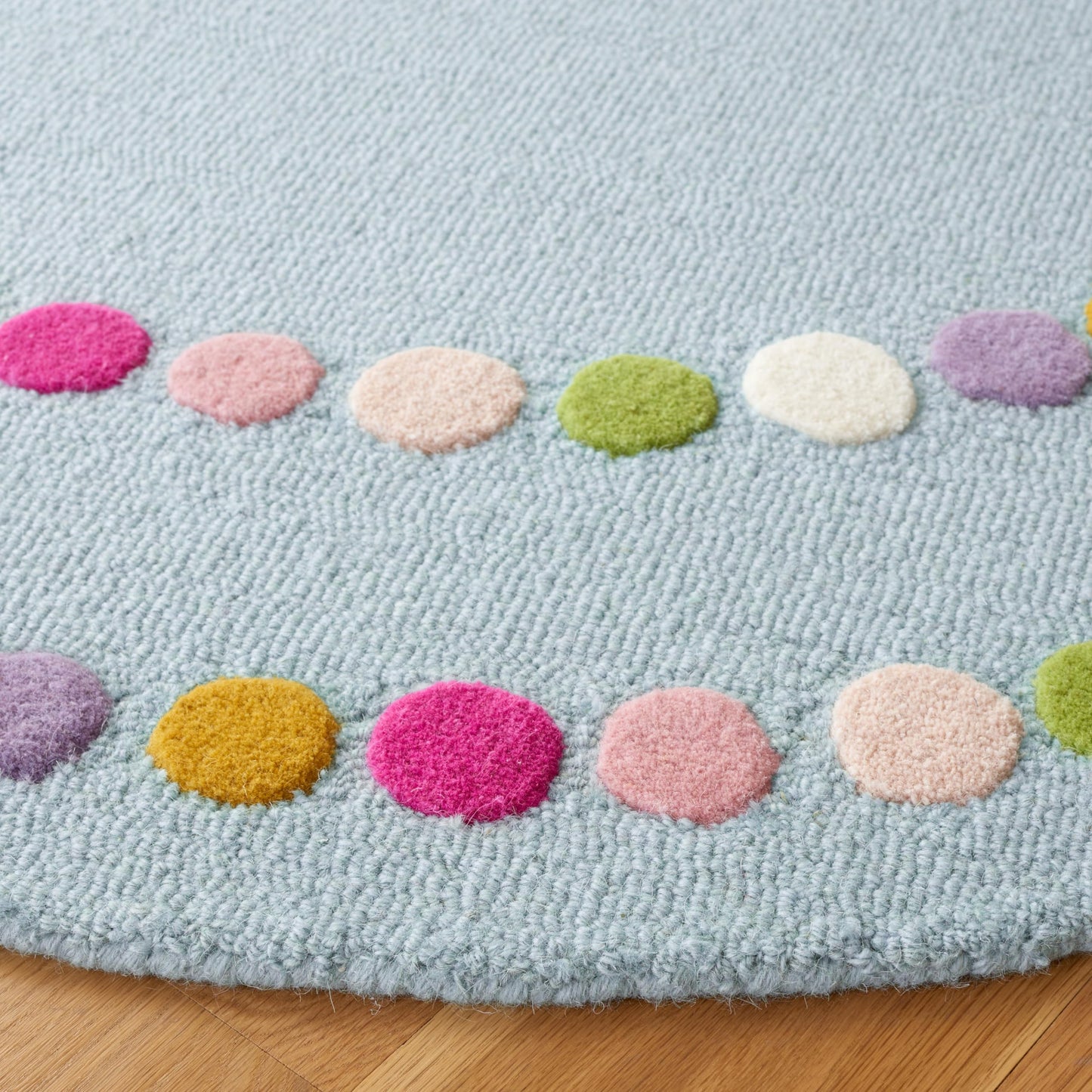 SAFAVIEH Kids Collection Area Rug - 5' Round, Blue & Pink, Polka Dot Border Design, Handmade Wool, Ideal for the Kids Room, Playroom, Nursery (SFK928M-5R)