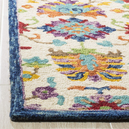 SAFAVIEH Aspen Collection Area Rug - 9' x 12', Ivory & Blue, Handmade Boho Floral Wool, Ideal for High Traffic Areas in Living Room, Bedroom (APN509A)