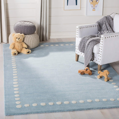 SAFAVIEH Kids Collection Accent Rug - 3' x 5', Blue & Ivory, Handmade Polka Dot Border Wool, Ideal for High Traffic Areas in Entryway, Living Room, Bedroom (SFK802M)