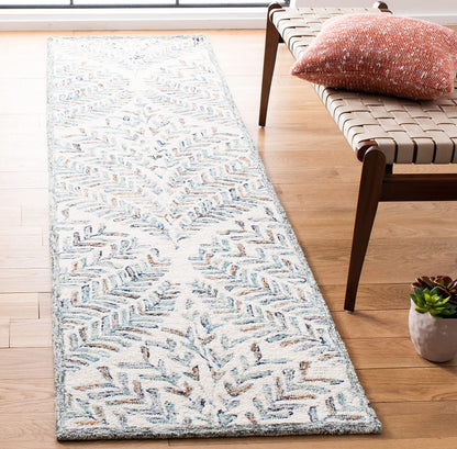 SAFAVIEH Capri Collection Area Rug - 2'3" x 11', Ivory & Blue, Handmade Wool, Ideal for High Traffic Areas in Living Room, Bedroom (CPR208A)
