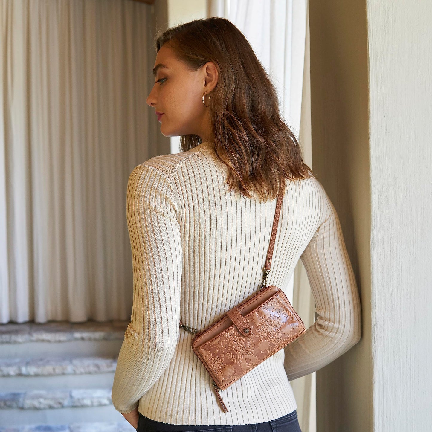 The Sak Iris Large Smartphone Crossbody Bag in Leather, Convertible Wristlet Purse Design, Black Leaf Embossed