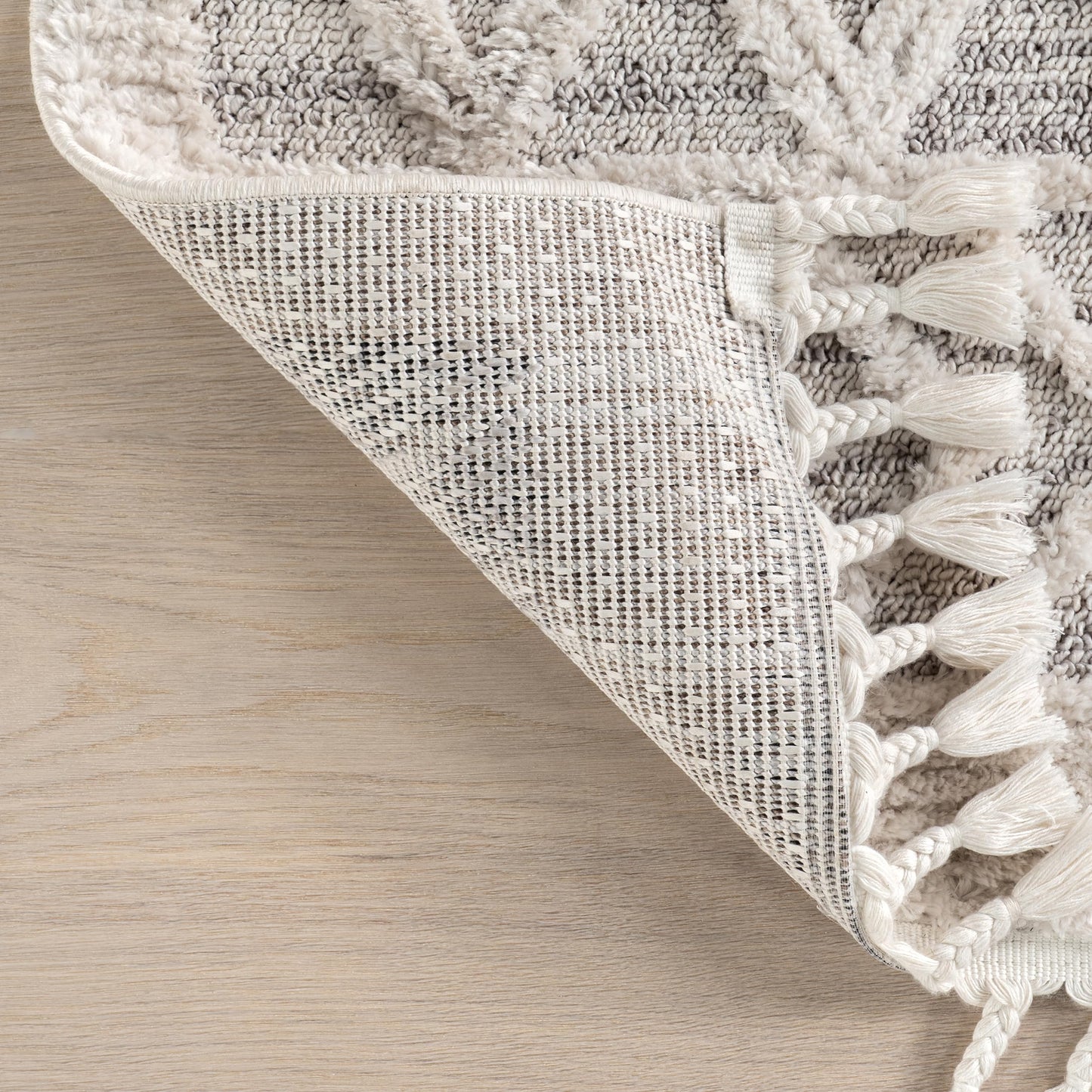 nuLOOM Oval 6'7" x 9' Ansley Moroccan Tassel Area Rug, Light Grey, High-Low Textured Bohemian Design, Plush High Pile, Stain Resistant, For Bedroom, Living Room, Hallway, Entryway
