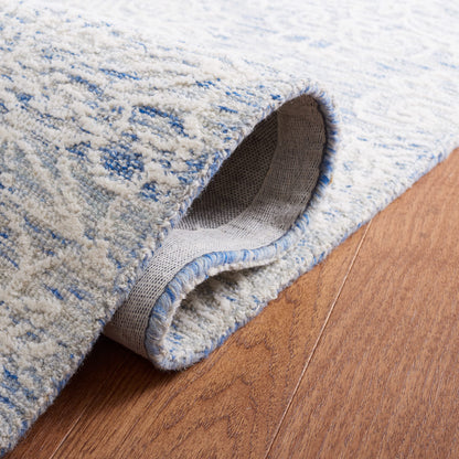 SAFAVIEH Metro Collection Accent Rug - 4' x 6', Blue & Ivory, Handmade Floral Wool, Ideal for High Traffic Areas in Entryway, Living Room, Bedroom (MET885M)