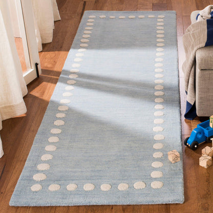 SAFAVIEH Kids Collection Accent Rug - 3' x 5', Blue & Ivory, Handmade Polka Dot Border Wool, Ideal for High Traffic Areas in Entryway, Living Room, Bedroom (SFK802M)