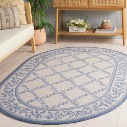 SAFAVIEH Chelsea Collection Area Rug - 4'6" x 6'6" Oval, Ivory & Light Blue, Hand-Hooked French Country Wool, Ideal for High Traffic Areas in Living Room, Bedroom (HK230A)