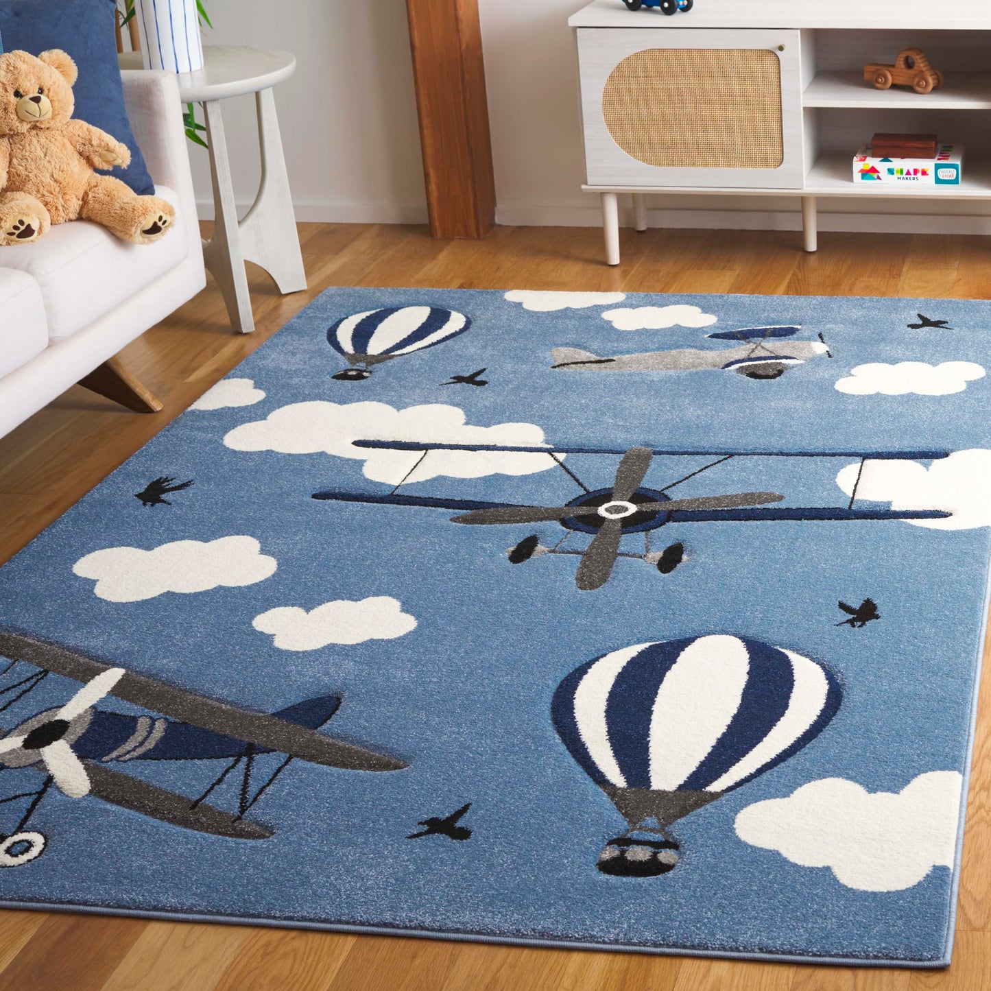 SAFAVIEH Carousel Kids Collection Area Rug - 5'3" x 7'6", Blue & Ivory, Non-Shedding & Easy Care, Ideal for High Traffic Areas for Boys & Girls in Playroom, Nursery, Bedroom (CRK137M-5)