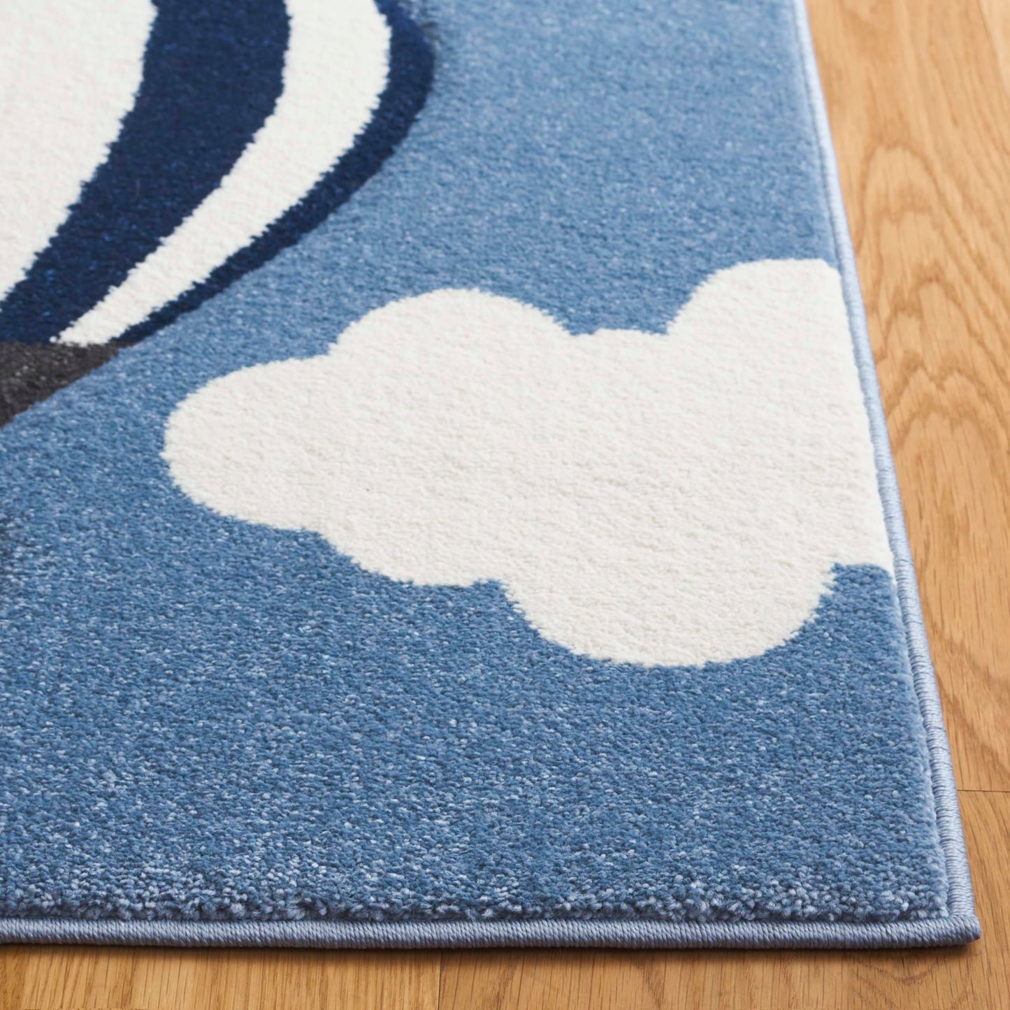 SAFAVIEH Carousel Kids Collection Area Rug - 5'3" x 7'6", Blue & Ivory, Non-Shedding & Easy Care, Ideal for High Traffic Areas for Boys & Girls in Playroom, Nursery, Bedroom (CRK137M-5)