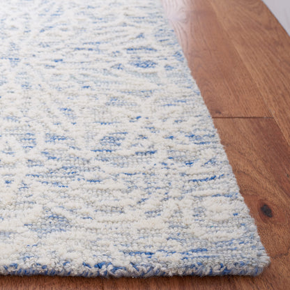 SAFAVIEH Metro Collection Accent Rug - 4' x 6', Blue & Ivory, Handmade Floral Wool, Ideal for High Traffic Areas in Entryway, Living Room, Bedroom (MET885M)