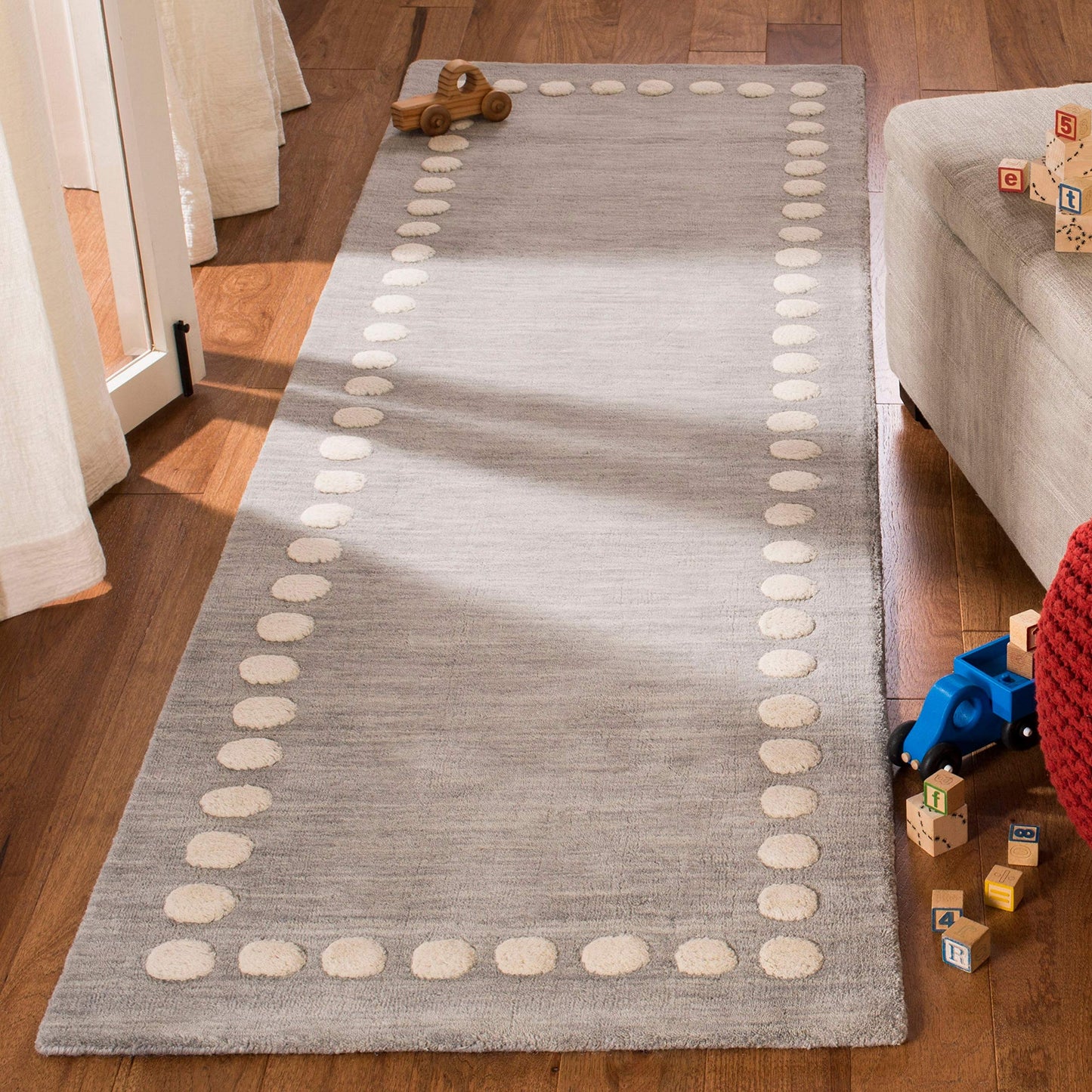 SAFAVIEH Kids Collection Accent Rug - 3' x 5', Blue & Ivory, Handmade Polka Dot Border Wool, Ideal for High Traffic Areas in Entryway, Living Room, Bedroom (SFK802M)