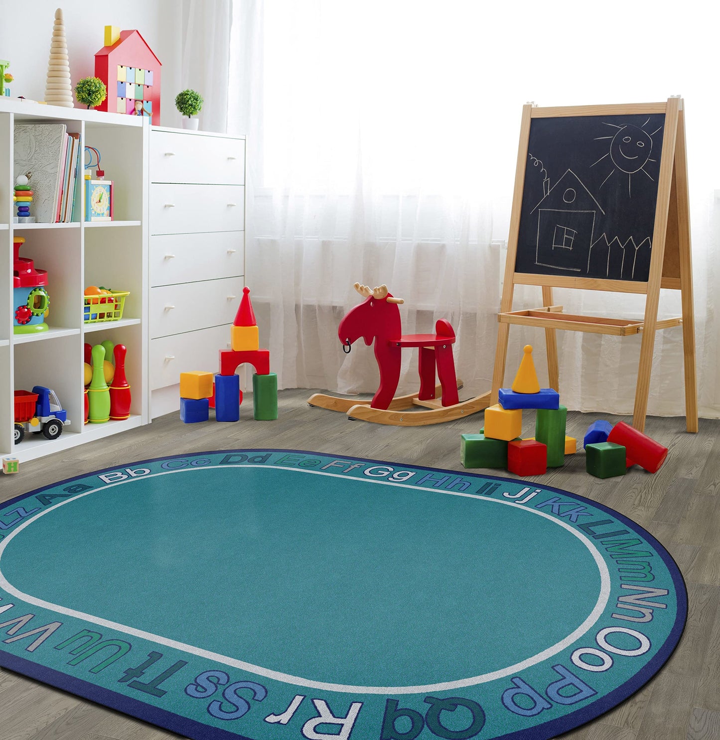 Flagship Carpets Know Your ABCs Educational Oval Area Rug for Preschool Kindergarten Alphabet Learning at Circle Time in the Classroom, Kids Room or Playroom, 7'6" x 12', Cool Blue