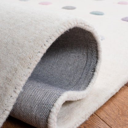 SAFAVIEH Kids Collection Area Rug - 5' x 8', Ivory, Handmade Polka Dot Wool, Ideal for High Traffic Areas in Living Room, Bedroom (SFK805A)