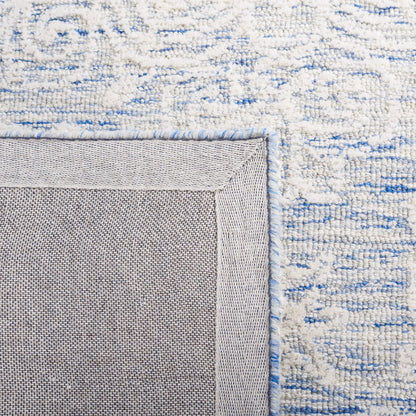 SAFAVIEH Metro Collection Accent Rug - 4' x 6', Blue & Ivory, Handmade Floral Wool, Ideal for High Traffic Areas in Entryway, Living Room, Bedroom (MET885M)