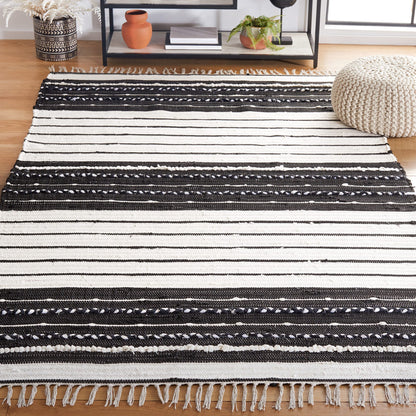 SAFAVIEH Striped Kilim Collection Accent Rug - 4' x 6', Black & Ivory, Flat Weave Boho Tassel Fringe Cotton Design, Easy Care, Ideal for High Traffic Areas in Entryway, Living Room, Bedroom (STK207Z)